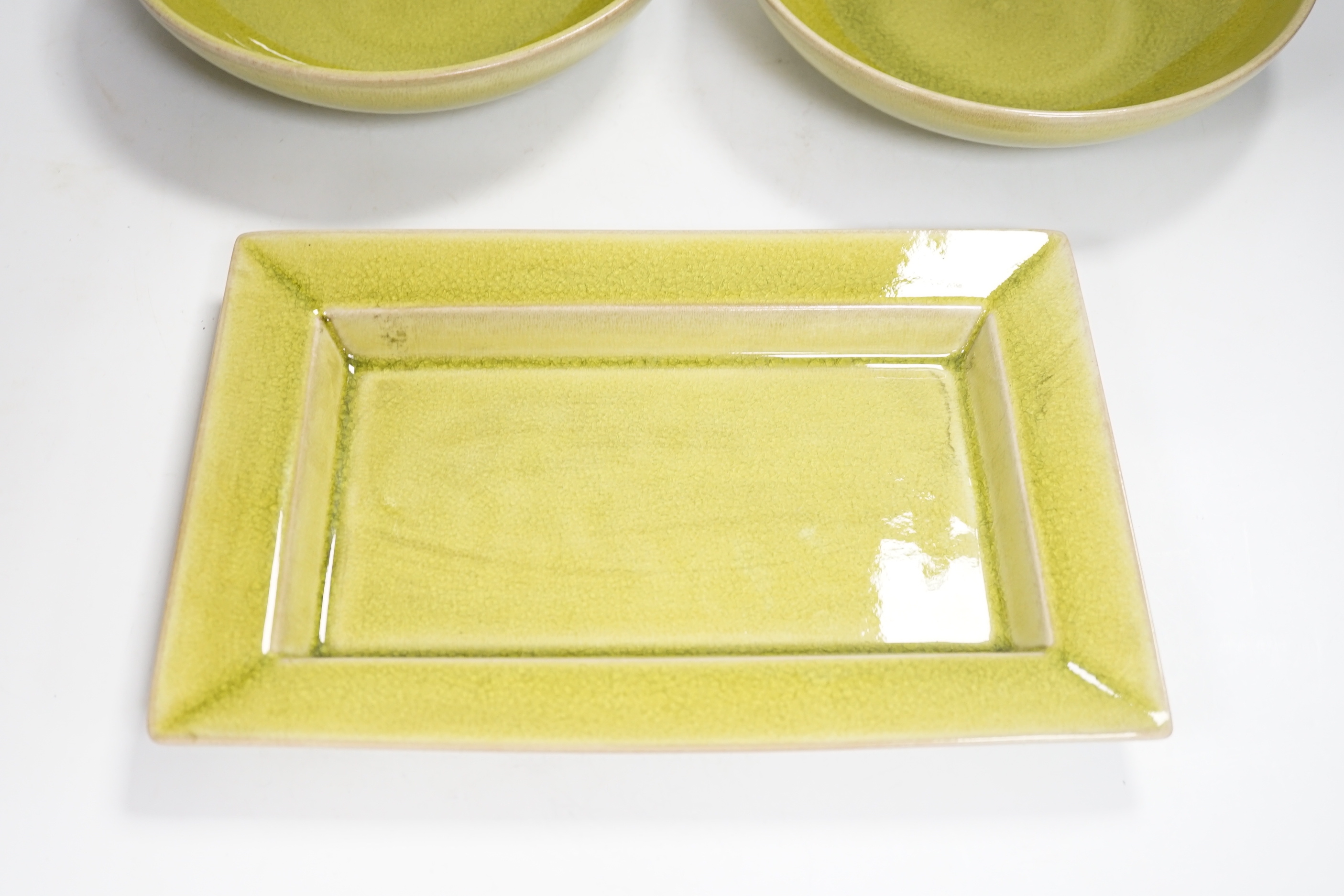 Two lime green crackle glazed bowls and a similar rectangular dish, by Jars of France, largest 30cm